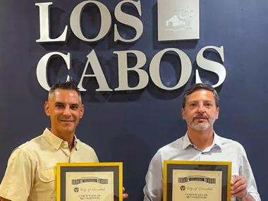 Adrián De Antoni and Rodrigo Esponda holding certificates of recognition from the City of Escondido