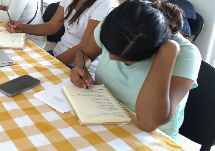 Women take notes during a session at VIFAC Los Cabos