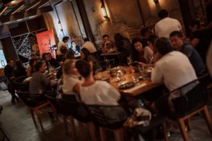 A full dining room at Lumbre on a busy night