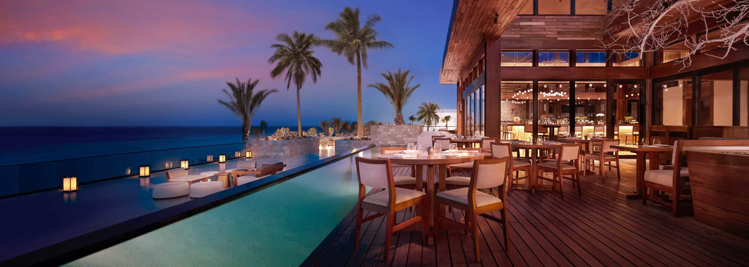 Oceanfront terrace dining at twilight at Nobu Los Cabos