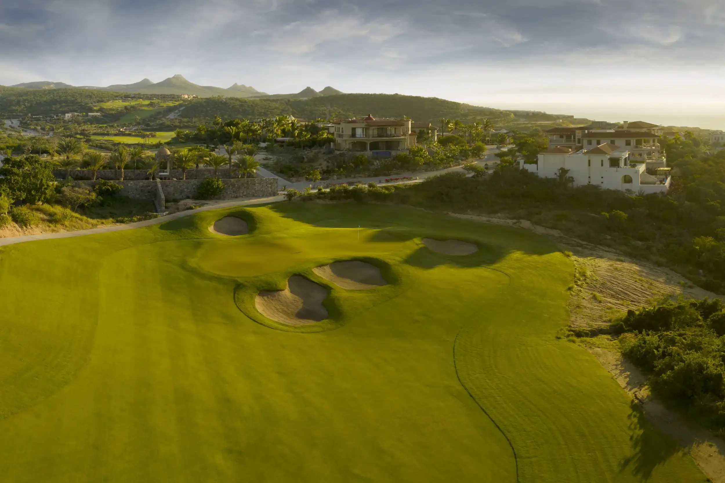 Bunkers guarding a Puerto Los Cabos green below the Sierra foothills