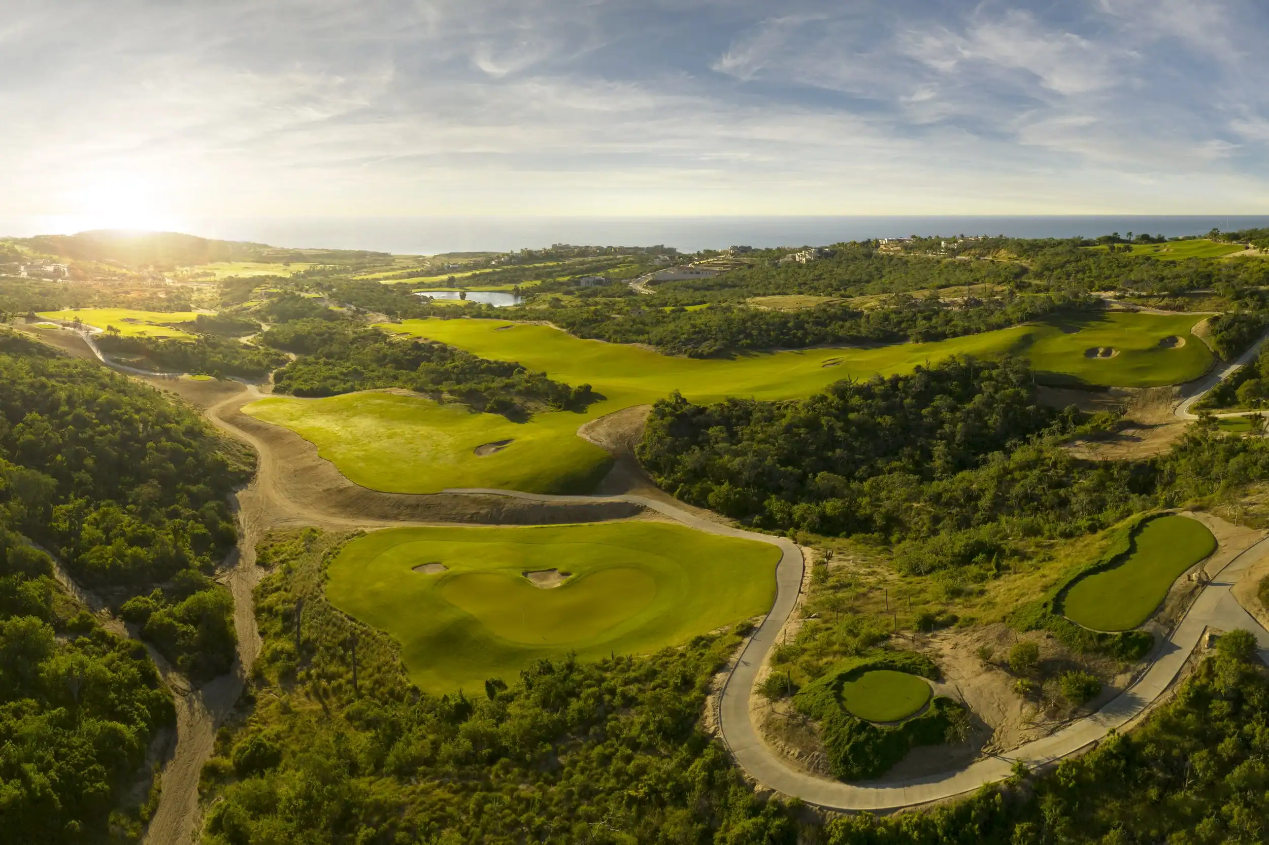 Aerial view across Puerto Los Cabos fairways toward the Sea of Cortez