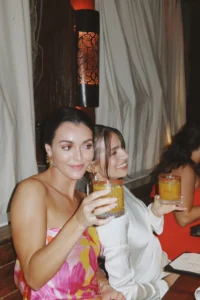 Guests enjoying cocktails in the candlelit dining room at Bar Esquina, Cabo San Lucas