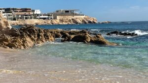 Clear water and rocky shoreline at Chileno Bay Public Beach