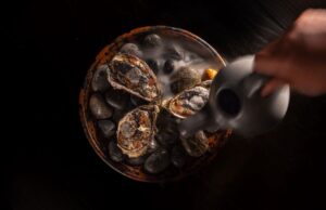 Smoked oysters served over hot stones with aromatic smoke at Humo, Zadún a Ritz-Carlton Reserve