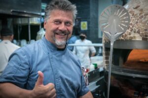 Chef Luigi Cavanna beside the wood-fired pizza oven at Il Forno, San Jose del Cabo