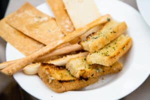 Plate of grilled bread, breadsticks and focaccia at Il Forno, San Jose del Cabo