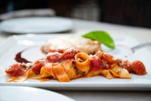 Homemade pappardelle in tomato sauce with basil and parmesan at Il Forno, San Jose del Cabo