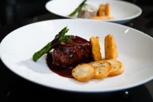 Beef medallion in red-wine sauce with asparagus and potatoes at Il Forno, San Jose del Cabo