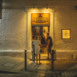 Lit restaurant entrance and facade at night