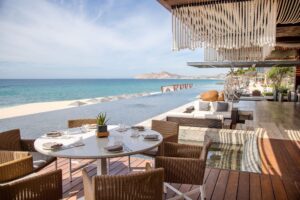 Set table on Mako's beachfront terrace with Land's End views, Solaz a Luxury Collection Resort