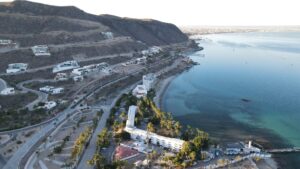 The scenic road, the hotel and the bay at Playa La Concha, with La Paz in the distance