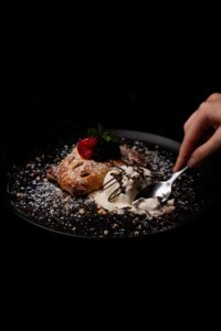 Apple strudel dessert with ice cream and berries at Solomon's Landing