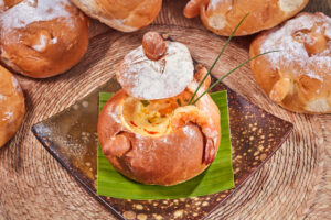 Shrimp bisque served in a hollowed bread bowl on a banana leaf at Tres Sirenas, Cabo San Lucas