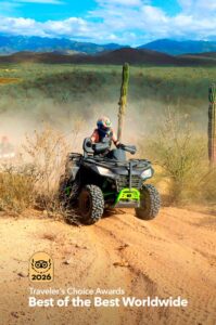 ATV rider descending the cactus-lined Sandy Snake circuit at Tierra Sagrada