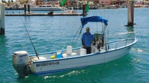 Panga Anamar moored in Cabo Marina with its fishing setup visible