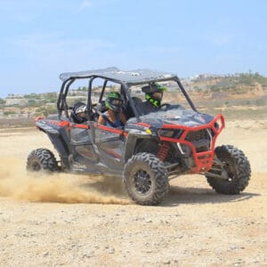 Four-seat UTV on an off-road section of the Wild Canyon tour