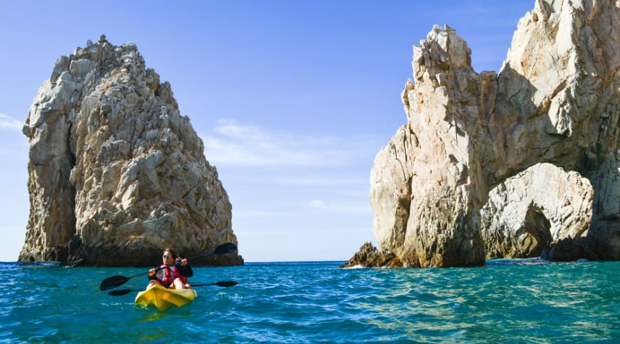 Kayaker approaching the Arch of Cabo San Lucas on a guided tour