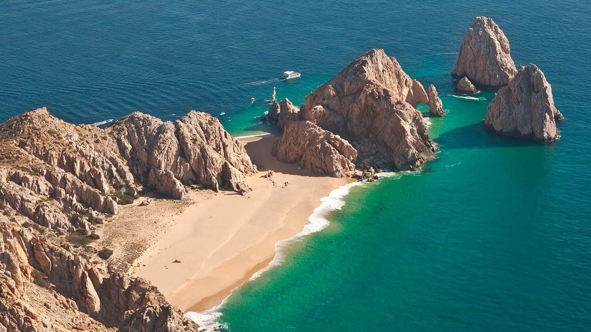 Aerial view of Lovers Beach at Lands End, Cabo San Lucas, with El Arco, the golden sand crescent and emerald water