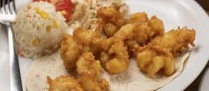 Battered shrimp on flour tortillas with rice and slaw at Mariscos El Toro Güero