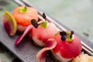 Salmon and tuna temari rice balls with microgreens and watermelon radish at The Green Room