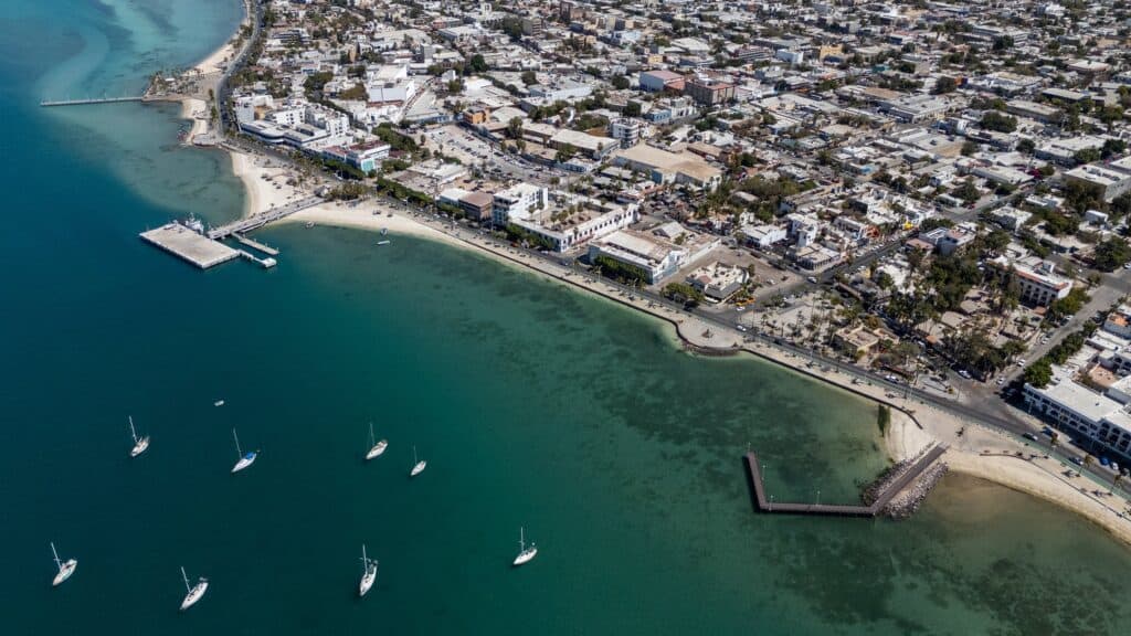 The malecón of La Paz, the beach and the moored sailboats from above
