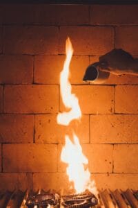 Flames rising inside the wood-fired brick oven of the kitchen at Monte Cardón
