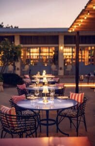Candlelit tables on the Main Terrace at Mozza Baja in the early evening