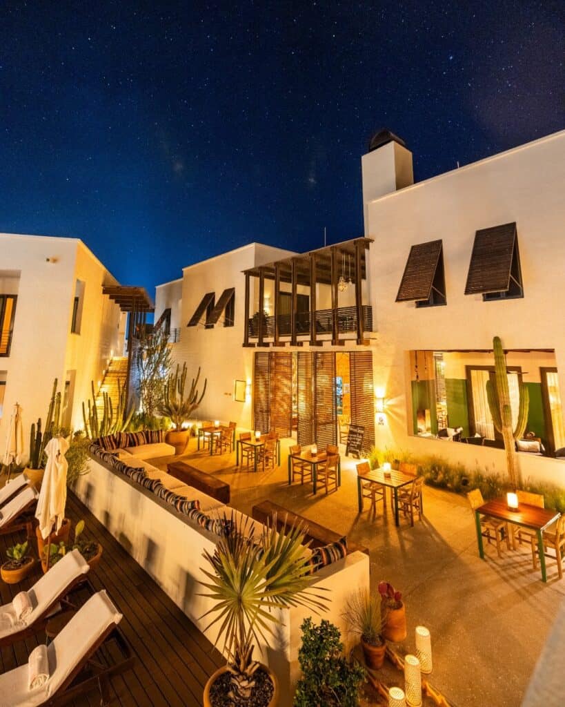 Hotel San Cristóbal and the terrace of Benno lit at night under the stars