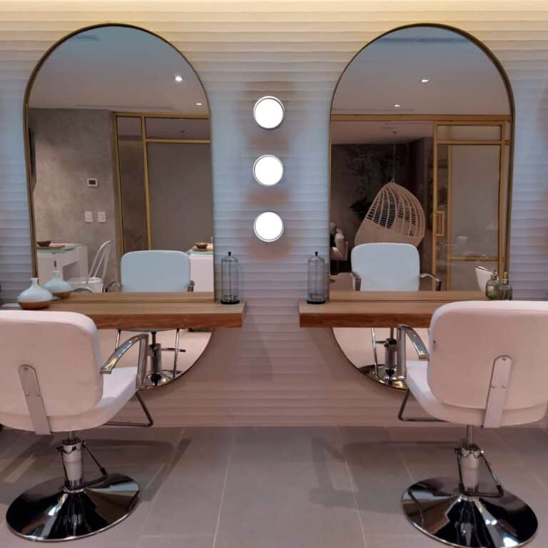 Two styling stations with arched mirrors in the Amura Spa salon