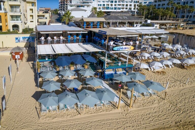 Aerial view of The Sand Bar on Médano Beach, with the massage deck on the upper floor