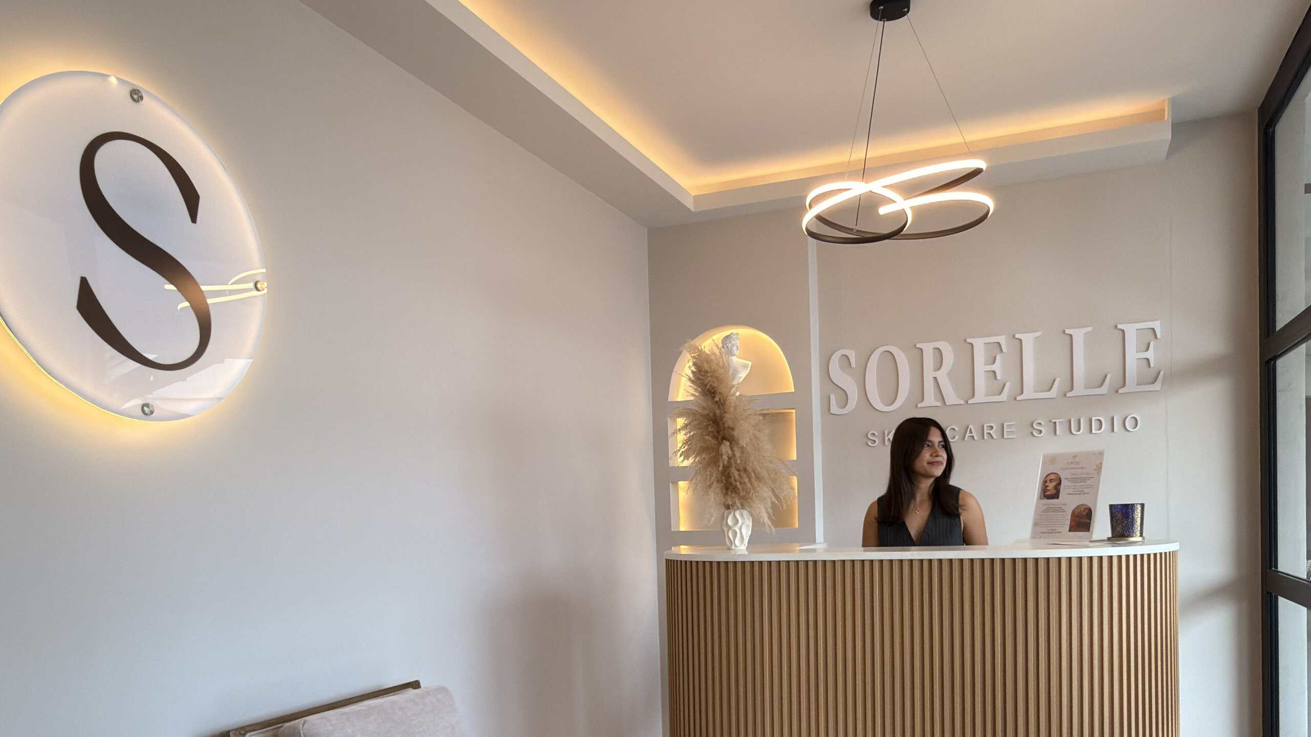 Reception desk at Sorelle Skin Care Studio in El Tezal, Cabo San Lucas, with the studio sign on the wall