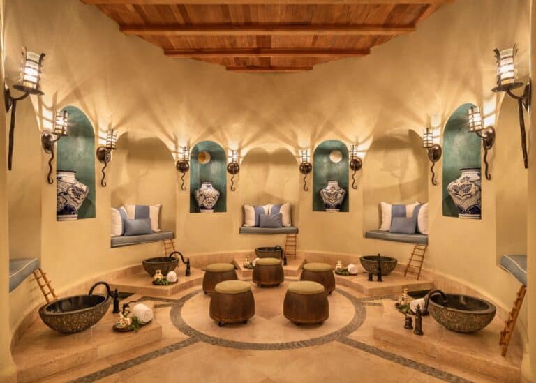 Soak ritual room with stone tubs, lanterns and tiled niches at Waldorf Astoria Spa