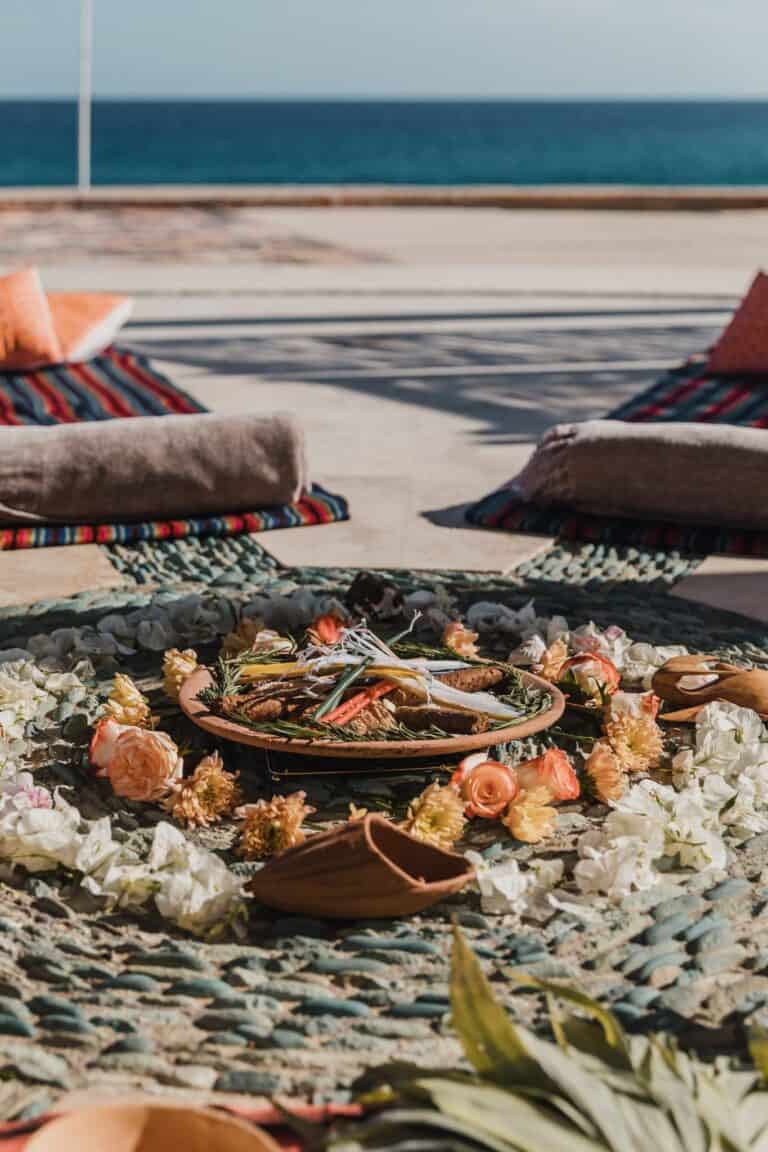 Cacao ceremony offering with flowers and herbs facing the ocean at Waldorf Astoria Los Cabos Pedregal